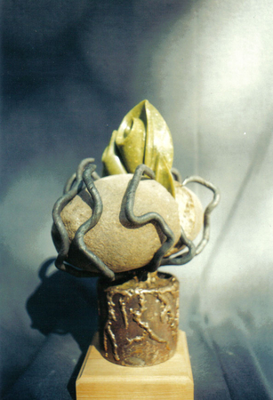 Breaking Through.  Granite, Serpentine, Steel, Bronze.  h. 22cm.  Private Collection