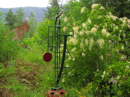 Pan.  Welded Steel, Stained Glass. h. 3 M.